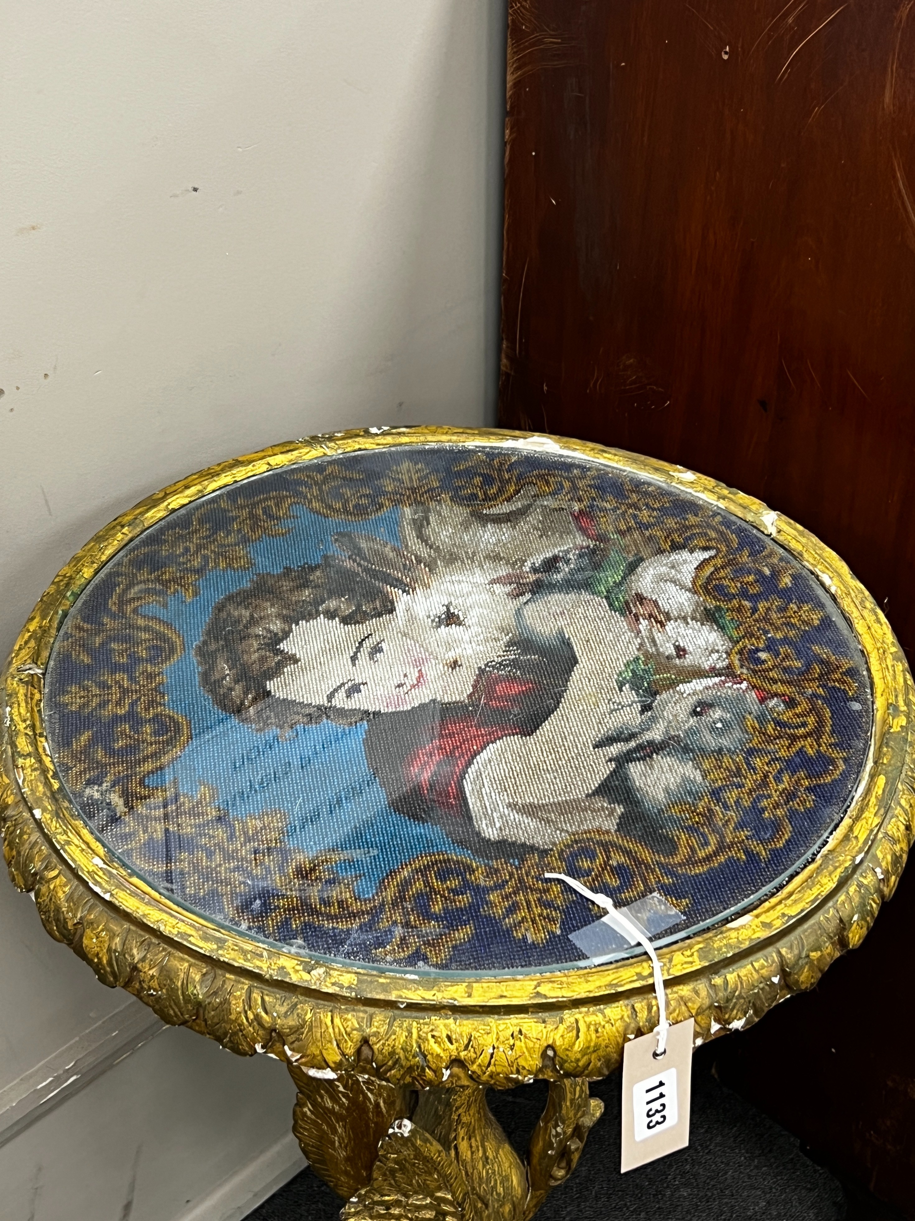 A Victorian giltwood and composition circular centre table with polychrome beadwork top on a carved heron stem and circular platform, diameter 49cm, height 82cm